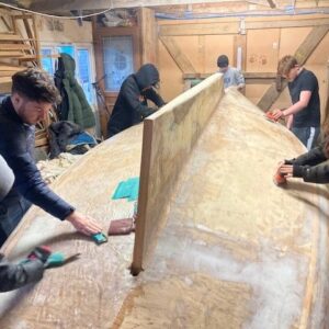 Students working on the boat restoration