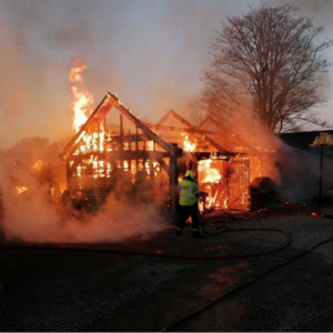 Boat Building Workshop on fire engulfed in flames.