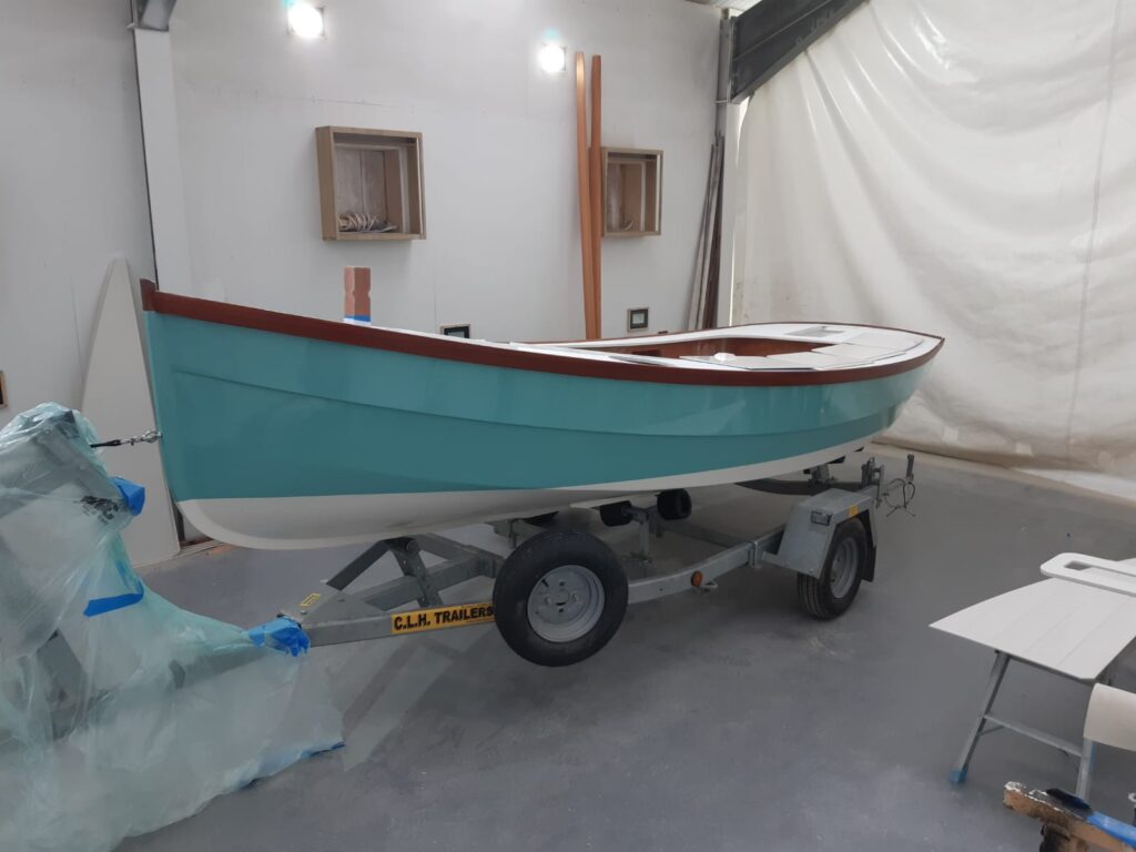 A transformed boat now covered in a light blue spray of paint by swallow yachts at their boatyard 