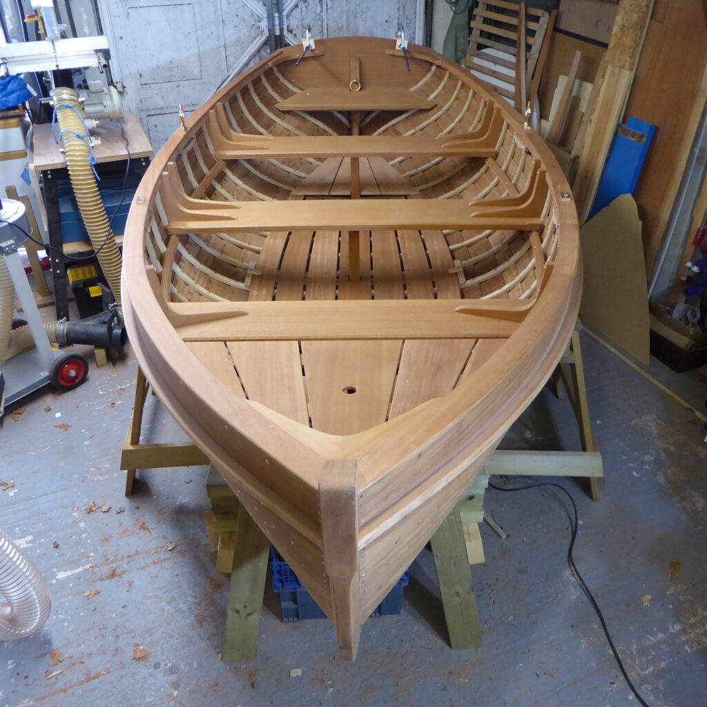 A boat made at the boat building academy in lyme regis incorporating west system epoxy into the build, sat in the warehouse