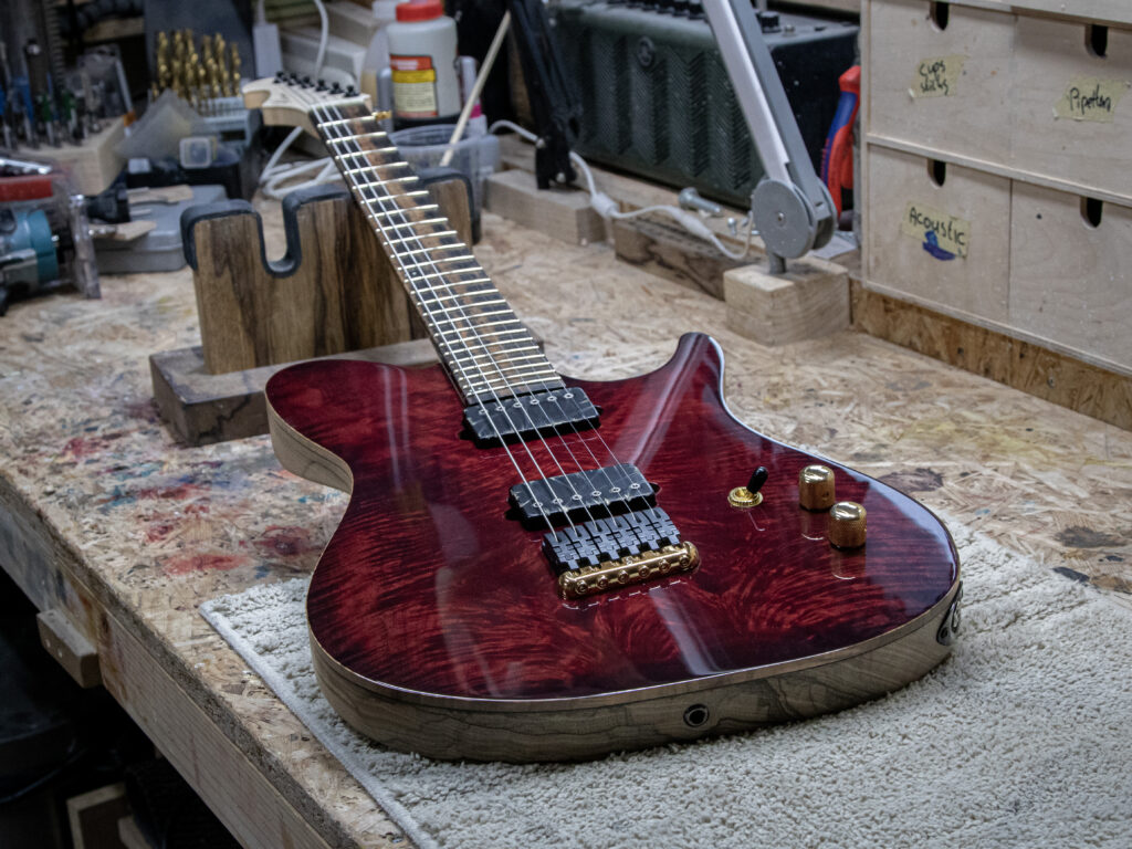 Red guitar made by 'wel guitars' using west system 