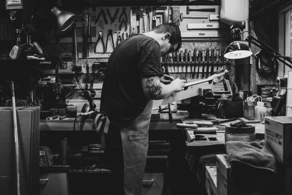 Maikel in the workshop making his guitars out of west system epoxy pic 2