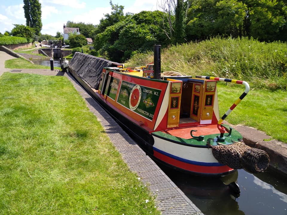 A fully restored narrow boat in the canal. 